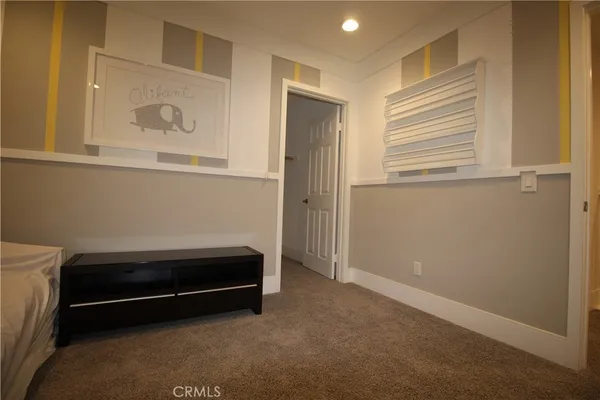 a room with a bed and a window