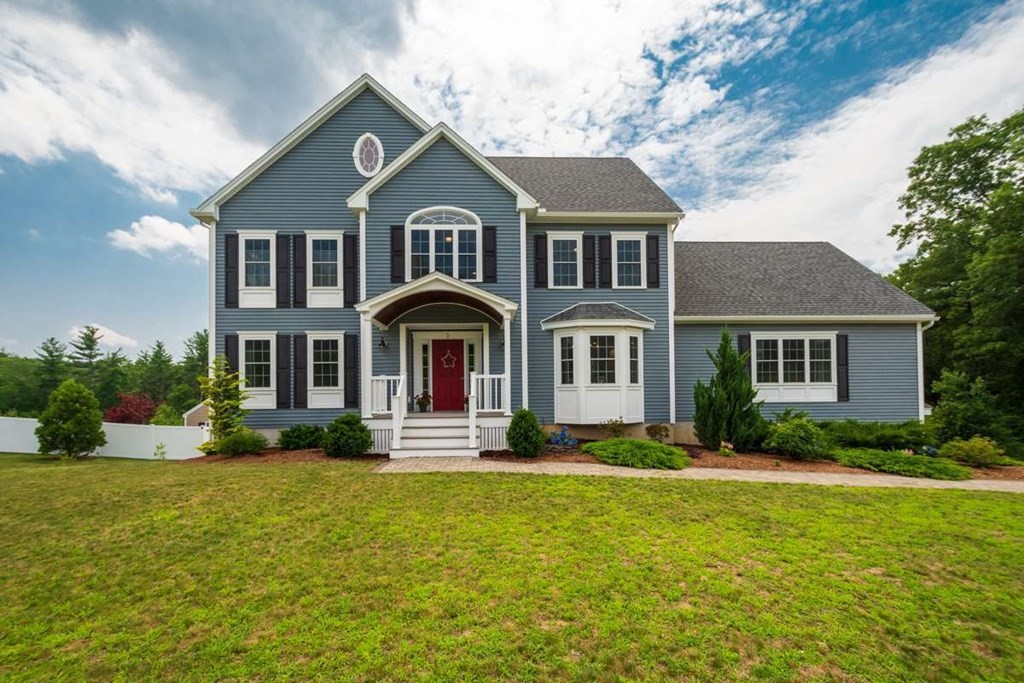 3 Quail Ridge Road Merrimac, MA 01860 - Photo 1 of 36 a front view of a house with garden