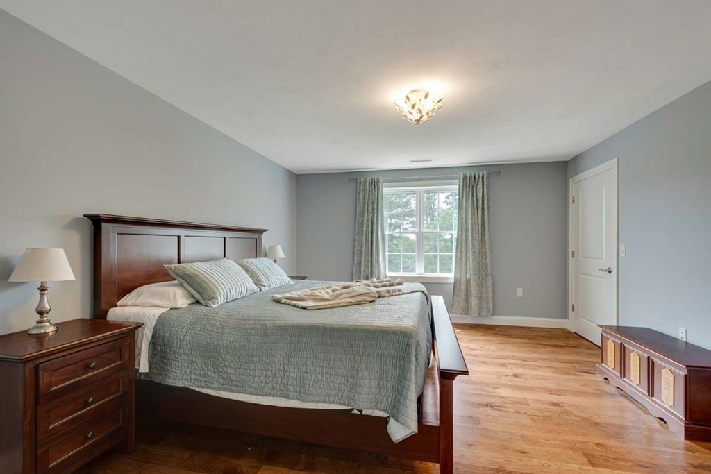 3 Quail Ridge Road Merrimac, MA 01860 - Photo 22 of 36 a bedroom with a bed and a night stand
