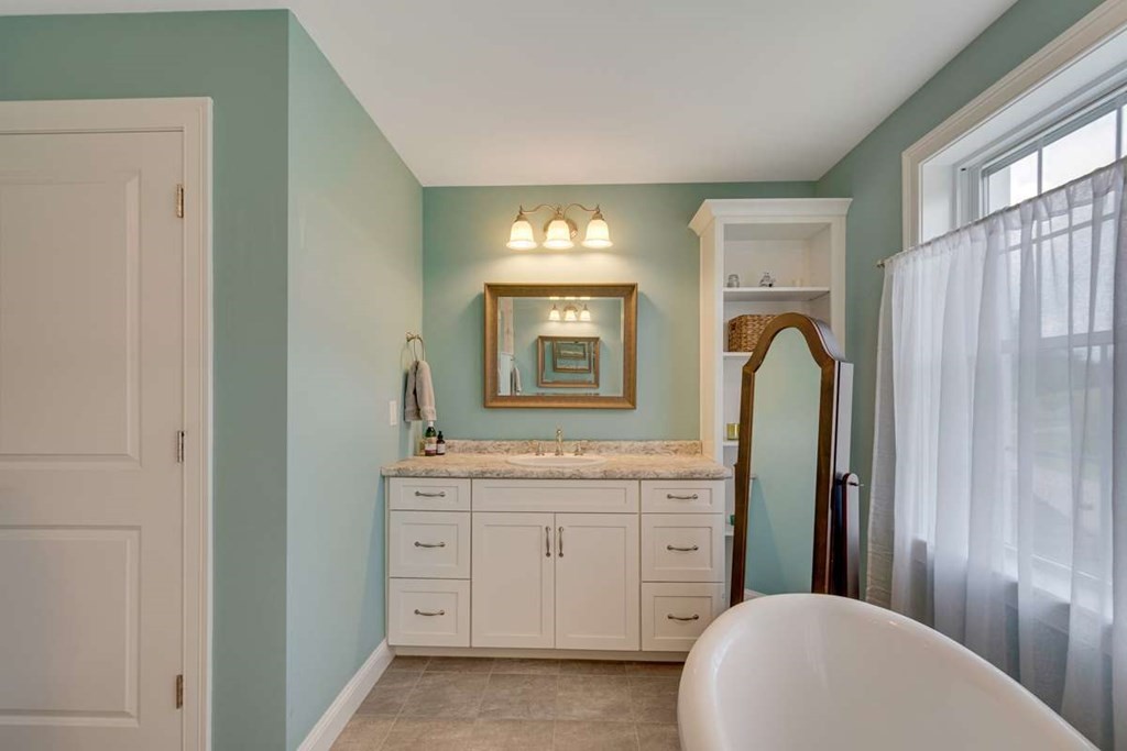 3 Quail Ridge Road Merrimac, MA 01860 - Photo 26 of 36 a spacious bathroom with a double vanity sink and a mirror