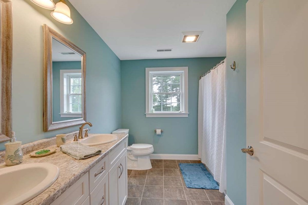 3 Quail Ridge Road Merrimac, MA 01860 - Photo 29 of 36 a bathroom with a granite countertop sink toilet and shower
