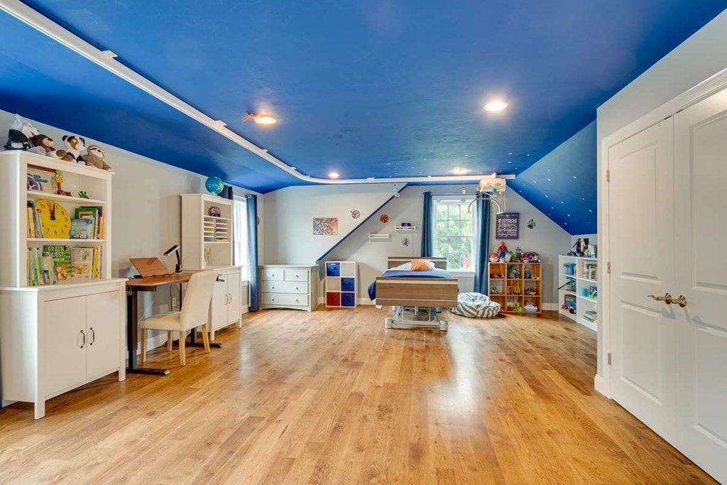 3 Quail Ridge Road Merrimac, MA 01860 - Photo 31 of 36 a living room with furniture and a wooden floor