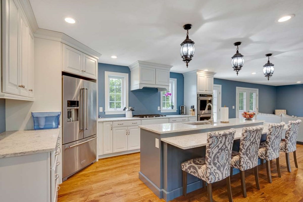 3 Quail Ridge Road Merrimac, MA 01860 - Photo 7 of 36 a kitchen with kitchen island granite countertop a sink a counter space stainless steel appliances cabinets and a center island