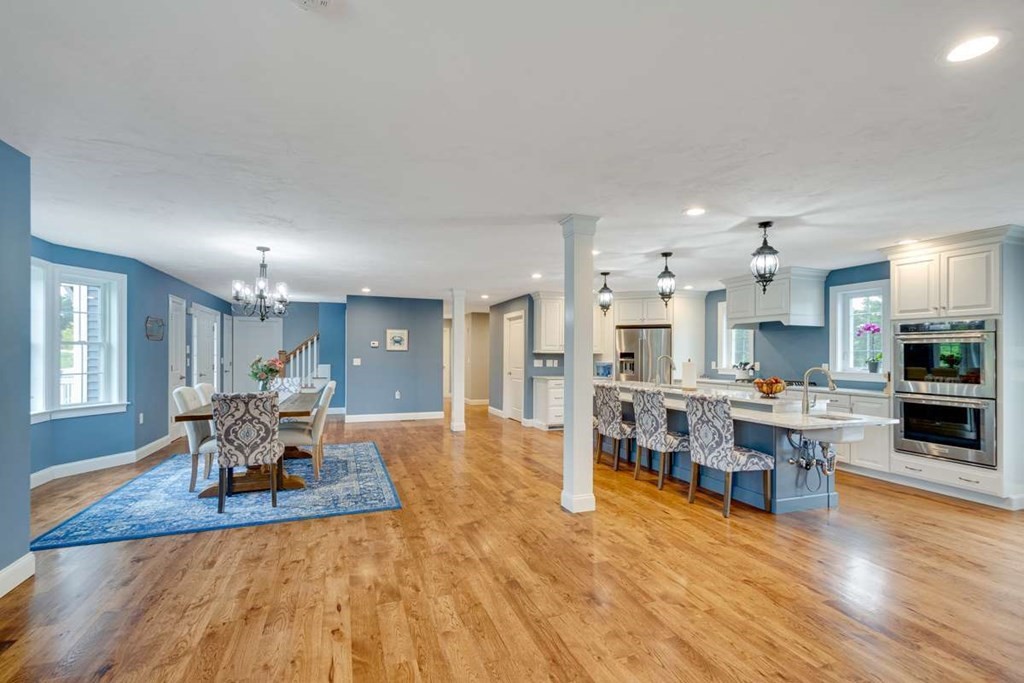 3 Quail Ridge Road Merrimac, MA 01860 - Photo 8 of 36 a living room with furniture kitchen view and a wooden floor