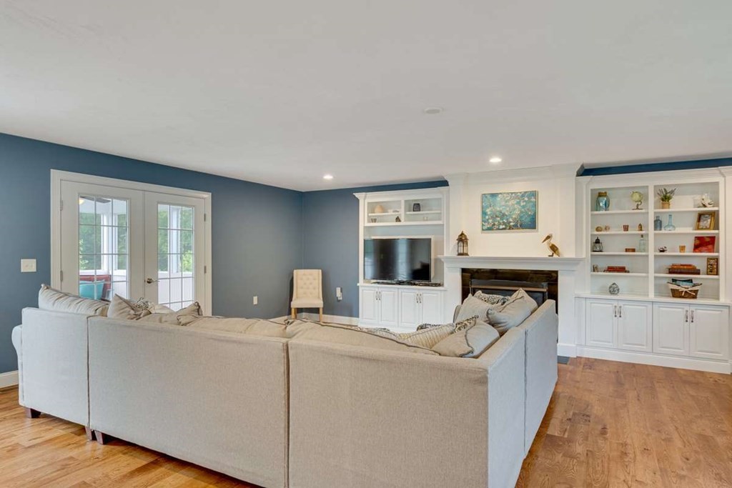 3 Quail Ridge Road Merrimac, MA 01860 - Photo 9 of 36 a living room with furniture a rug and a fireplace