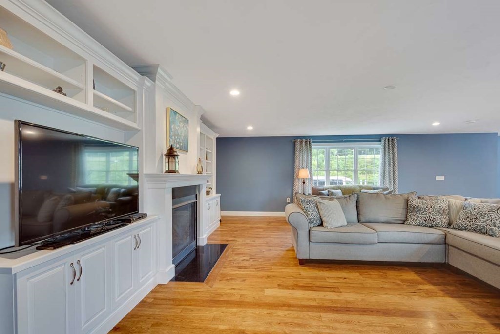 3 Quail Ridge Road Merrimac, MA 01860 - Photo 10 of 36 a living room with furniture and a flat screen tv