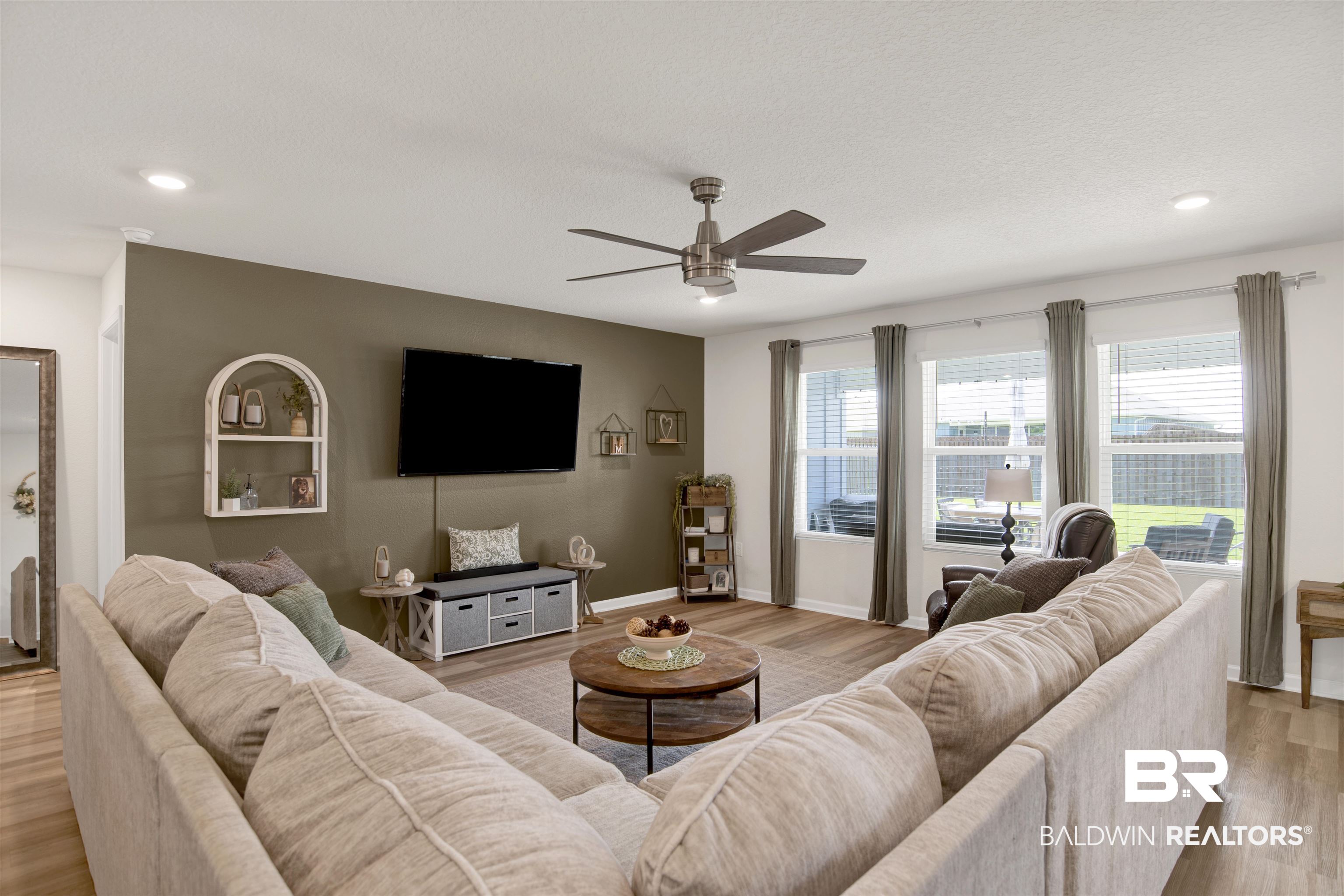 22301 Early Dawn Circle Foley, AL 36535 - Photo 22 of 45 Spacious living area featuring wood-finish flooring, recessed lighting, and a ceiling fan