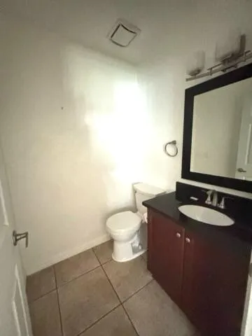 a sign that is in front of flowers