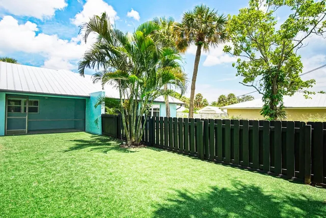 a view of a backyard with a trees and plants