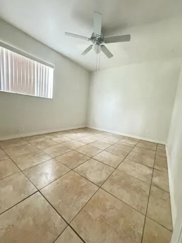 a kitchen with granite countertop a sink and cabinets