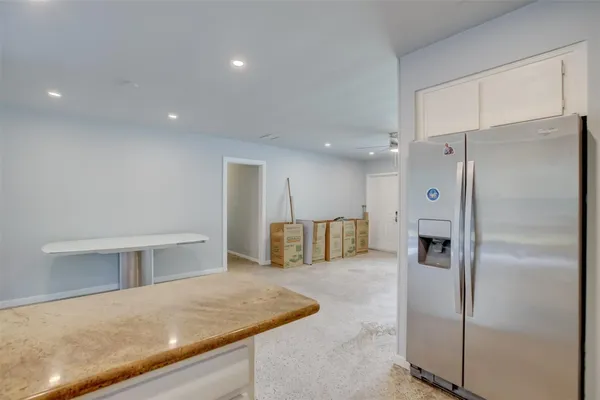a kitchen with stainless steel appliances refrigerator oven and cabinets