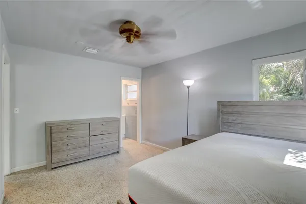 a bedroom with a bed and a dresser