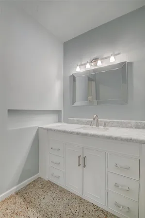 a bathroom with a bathtub and shower