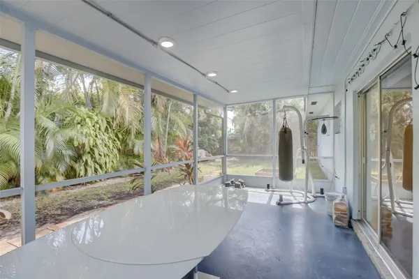 a porch with a bench in front of it