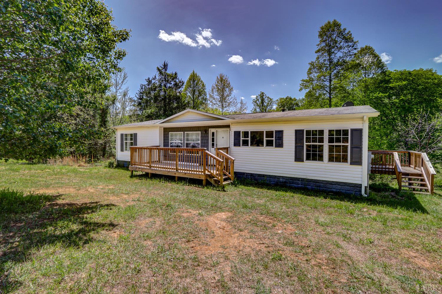 102 Slow Water Court Sandy Level, VA 24161 - Photo 5 of 66 a view of a house with a yard balcony and wooden fence