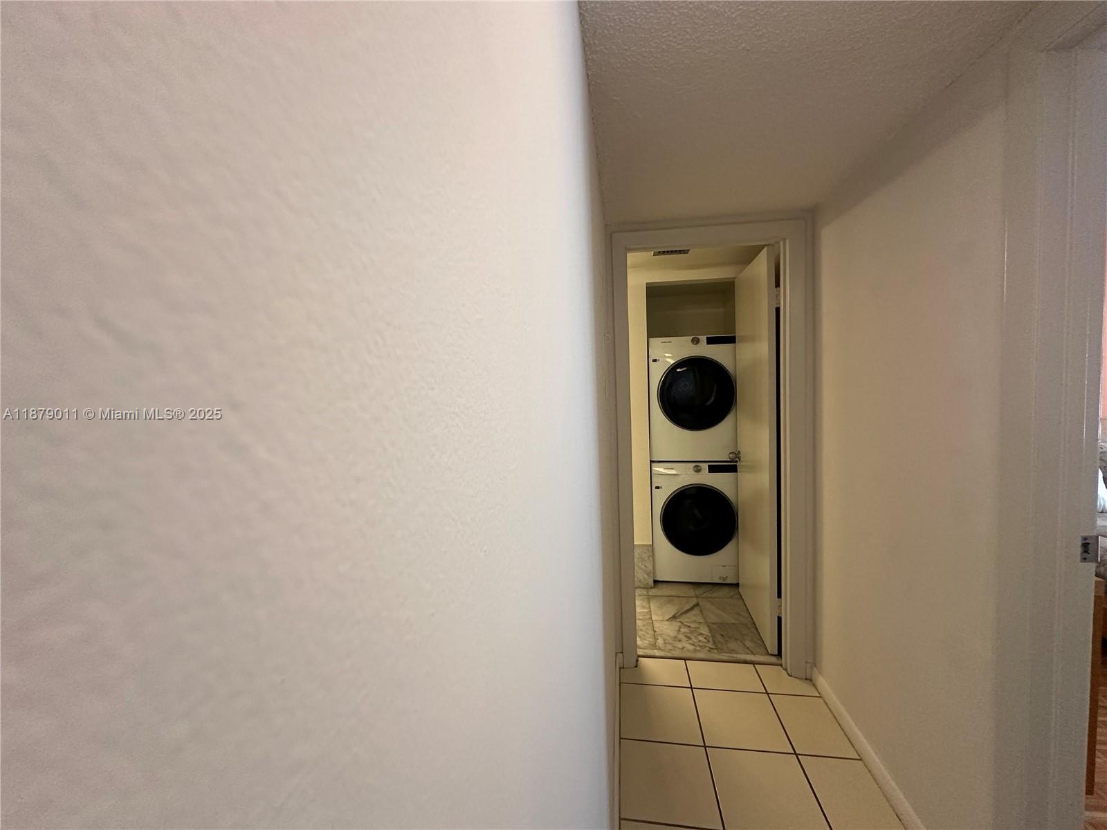 5415 Collins Avenue, Unit 302A Miami Beach, FL 33140 - Photo 11 of 20 a bathroom with a toilet and a mirror