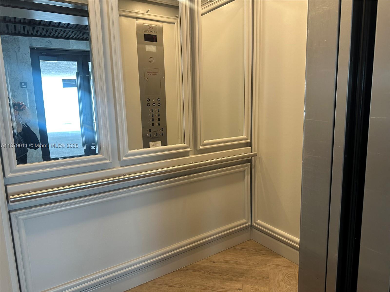 5415 Collins Avenue, Unit 302A Miami Beach, FL 33140 - Photo 16 of 20 a view of a closet area with a mirror