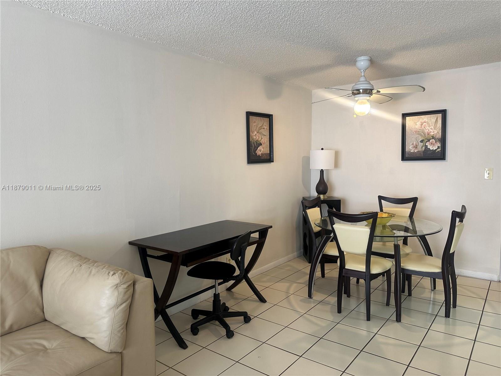 5415 Collins Avenue, Unit 302A Miami Beach, FL 33140 - Photo 5 of 20 a view of a dining room with furniture