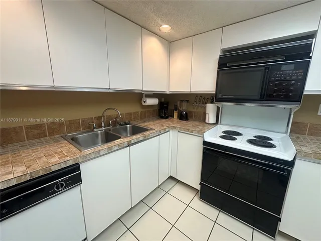 a living room with a bed and a couch