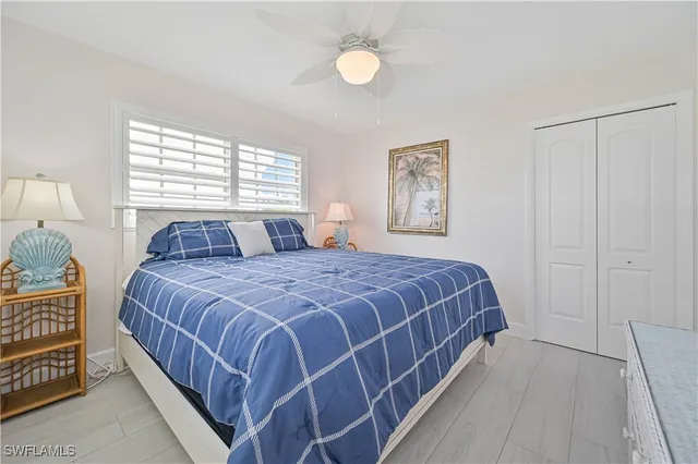 a bedroom with bed and a couch