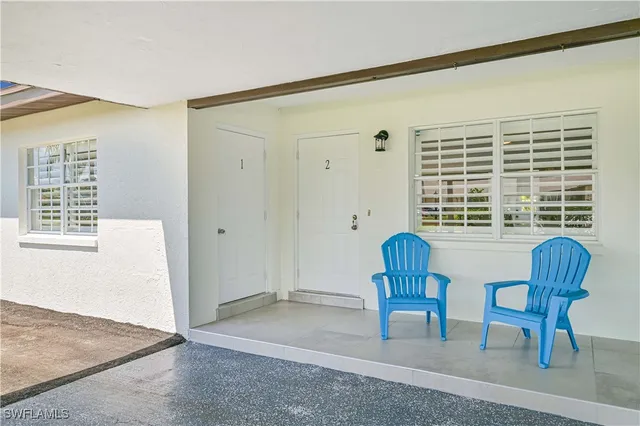 a view of living room with furniture and windows