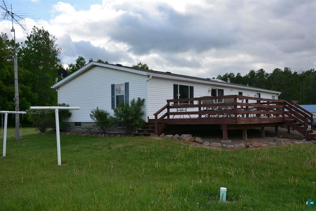 42589 Root Road Bruno, MN 55712 - Photo 3 of 23 Grill, entertain or just enjoy nature from your back deck.