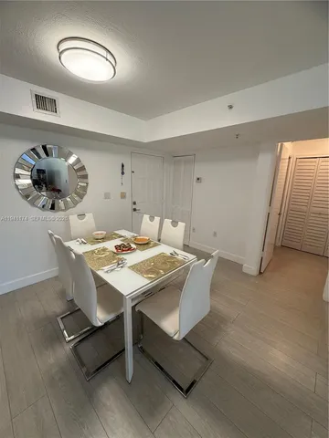 a bathroom with a sink mirror vanity and toilet