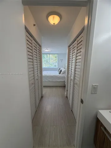 a bedroom with two beds and a couch