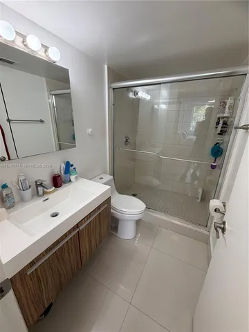 a view of a house with a yard and a lake view