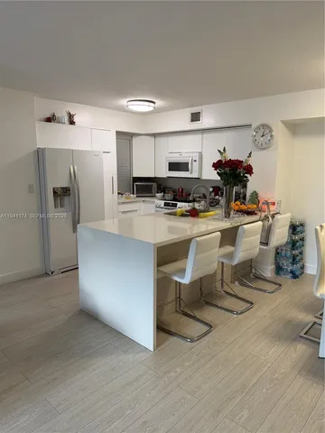 a living room with lots of furniture and appliances