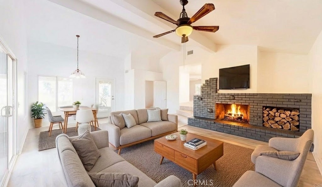 16201 Alta Cresta Avenue Riverside, CA 92508 - Photo 1 of 51 a living room with furniture and a fireplace