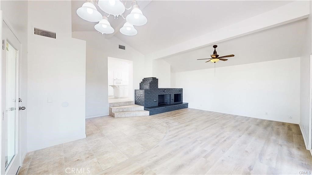 16201 Alta Cresta Avenue Riverside, CA 92508 - Photo 11 of 51 a view of a livingroom with a chandelier furniture and a chandelier fan