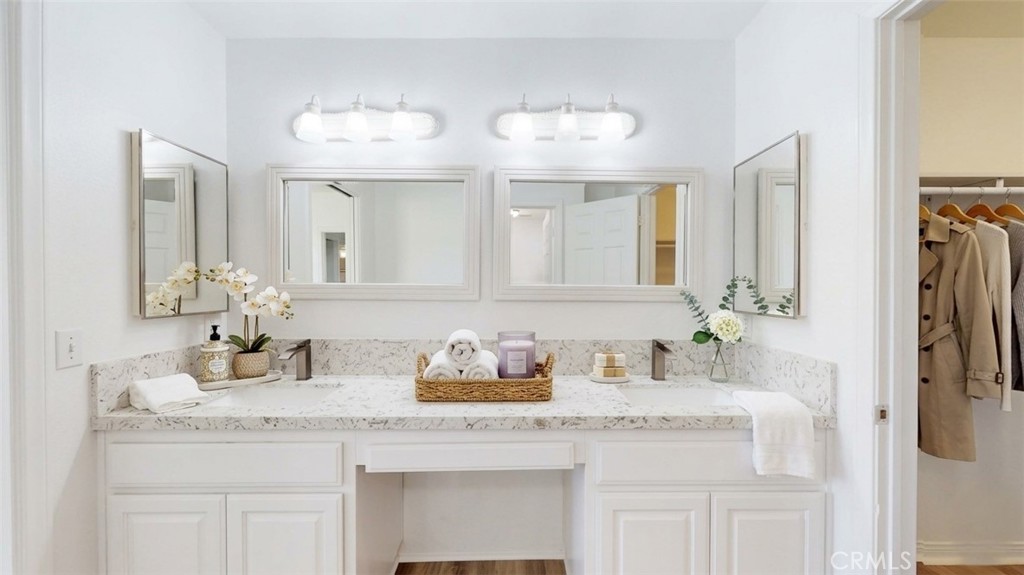 16201 Alta Cresta Avenue Riverside, CA 92508 - Photo 20 of 51 a bathroom with a sink and a mirror