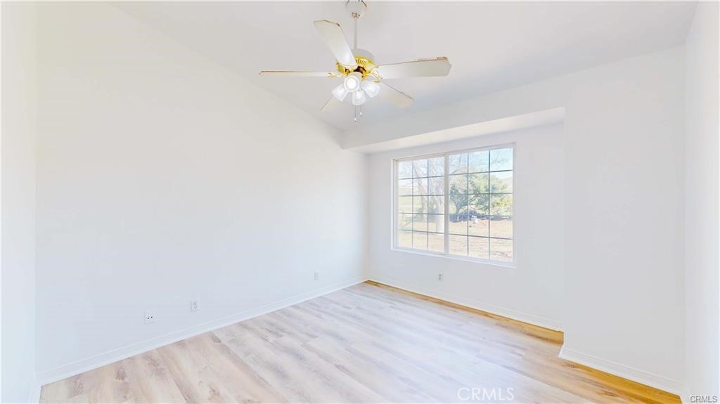 16201 Alta Cresta Avenue Riverside, CA 92508 - Photo 26 of 51 an empty room with a window and a fan