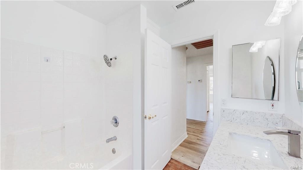 16201 Alta Cresta Avenue Riverside, CA 92508 - Photo 30 of 51 a bathroom with a bathtub and a shower