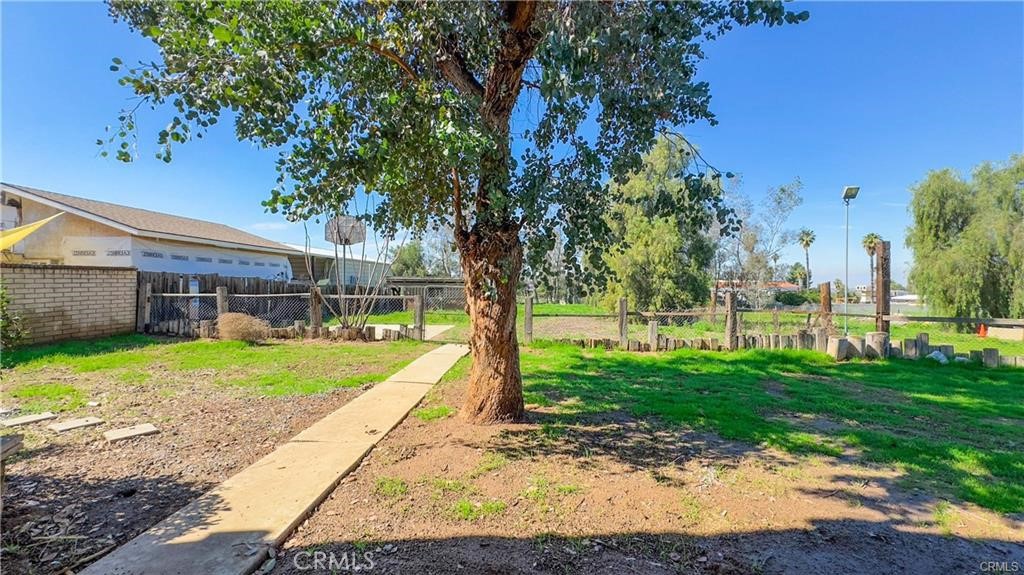 16201 Alta Cresta Avenue Riverside, CA 92508 - Photo 44 of 51 a view of a house with backyard and a tree