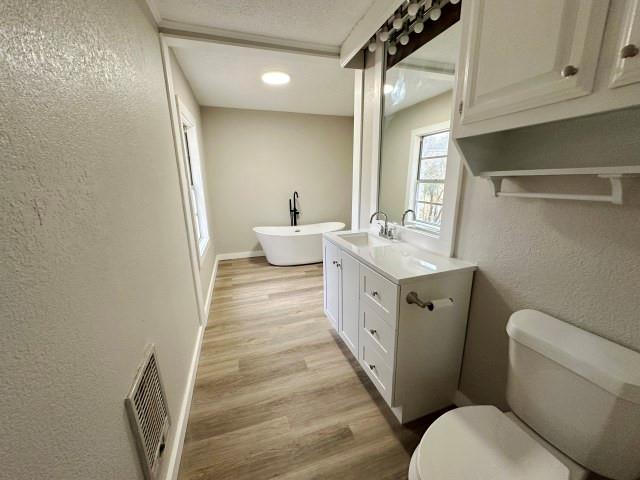 7121 McGregor Park Road Temple, TX 76502 - Photo 17 of 21 a bathroom with a sink a toilet a mirror and shower