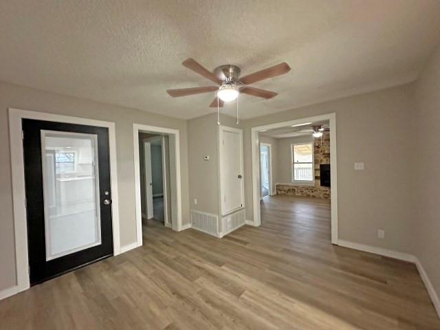 7121 McGregor Park Road Temple, TX 76502 - Photo 18 of 21 a view of a livingroom with wooden floor and a ceiling fan