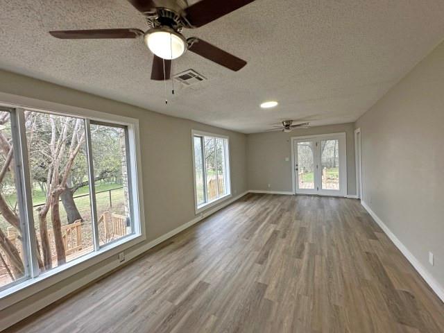 7121 McGregor Park Road Temple, TX 76502 - Photo 9 of 21 a view of an empty room with wooden floor and a window