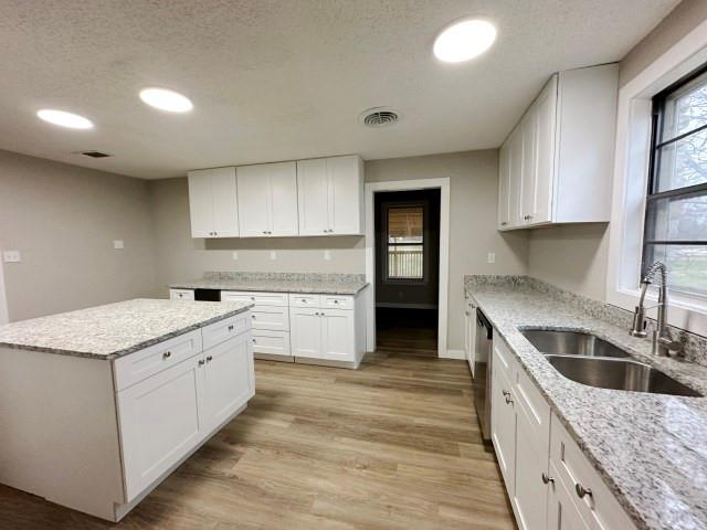 7121 McGregor Park Road Temple, TX 76502 - Photo 10 of 21 a kitchen with a stove top oven sink and cabinets