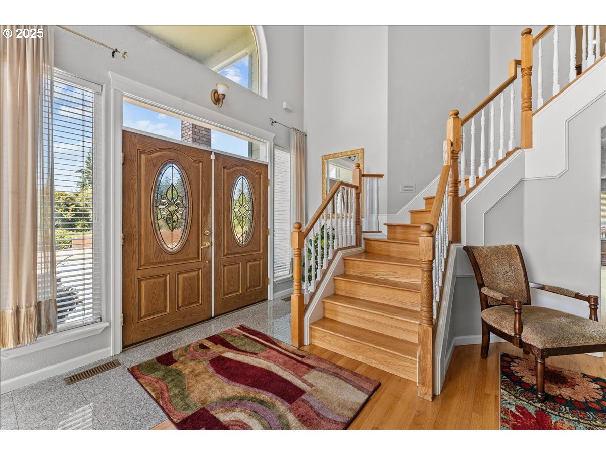 5122 Southeast Jenne Road Portland, OR 97236 - Photo 14 of 36 a view of entryway with wooden floor and windows