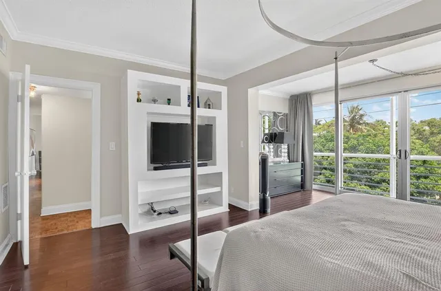 a bedroom with a bed and a mirror