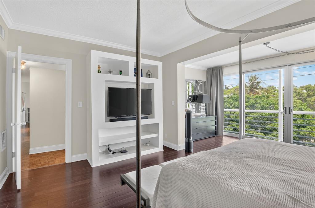 850 Northeast Spanish River Boulevard, Unit 33 Boca Raton, FL 33431 - Photo 13 of 37 a room with a bed and a large window