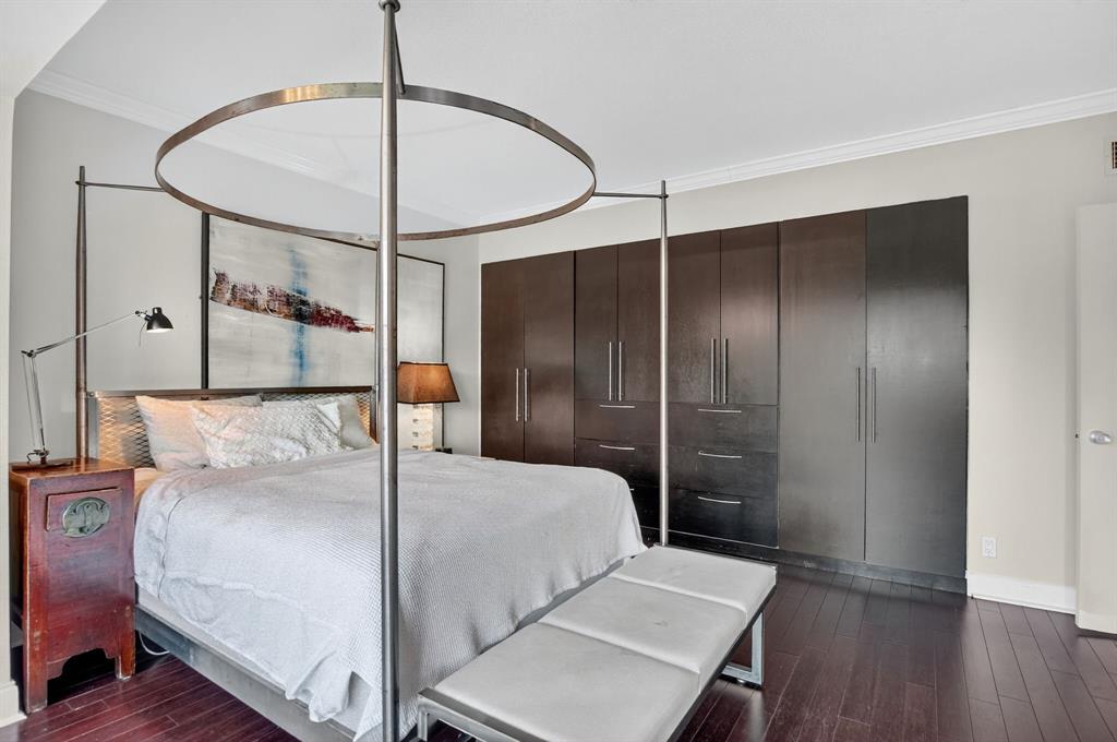 850 Northeast Spanish River Boulevard, Unit 33 Boca Raton, FL 33431 - Photo 14 of 37 a bedroom with a bed and a mirror