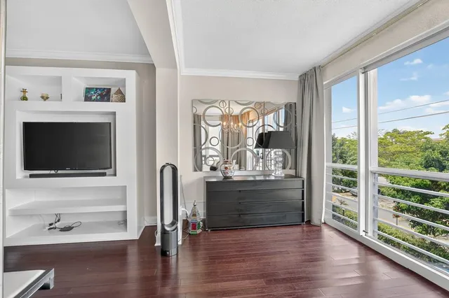 a bathroom with a toilet a sink and shower