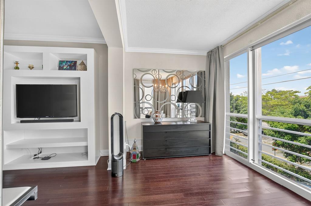 850 Northeast Spanish River Boulevard, Unit 33 Boca Raton, FL 33431 - Photo 15 of 37 a view of living room with furniture and flat screen tv