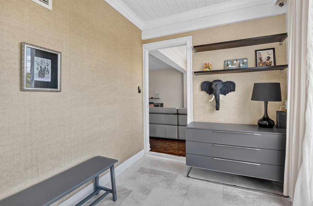 850 Northeast Spanish River Boulevard, Unit 33 Boca Raton, FL 33431 - Photo 19 of 37 a room with a bench and cabinets