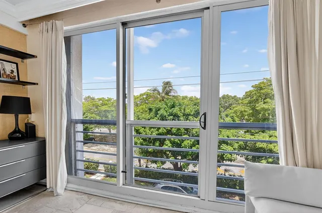 a view of a hallway with a white door