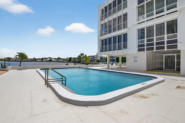 a view of swimming pool with outdoor space and seating area