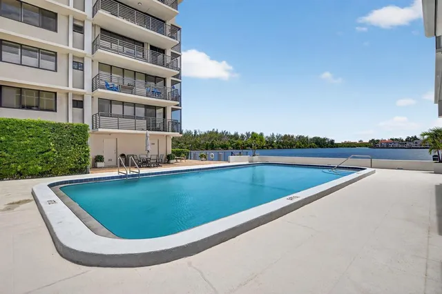 a view of a patio with a table and chairs